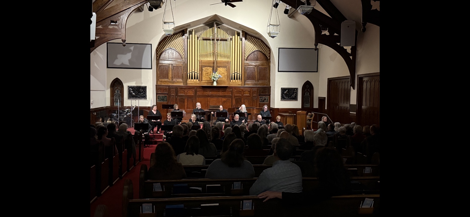 A full audience watches TASA's reader's theatre production of Twelve Angry Men